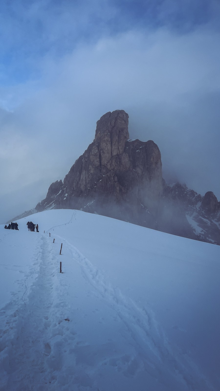Snow-covered peak under a deep blue sky